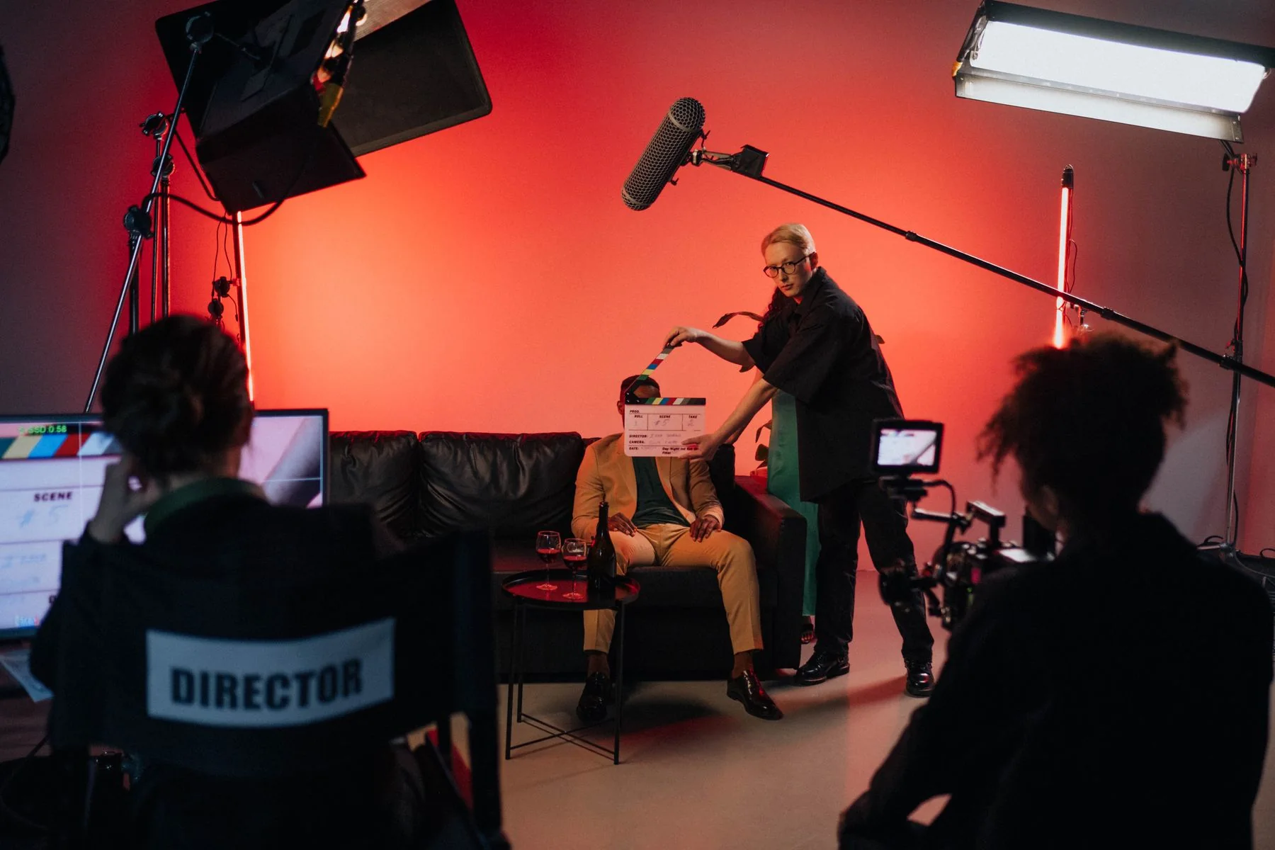 Filmmaker on a red-lit set