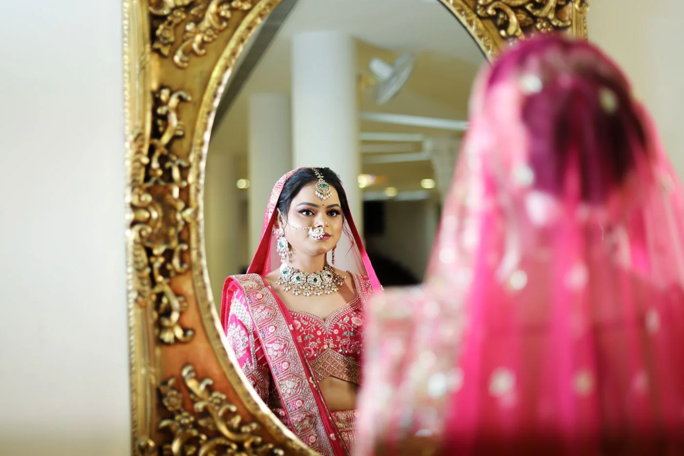 Bride getting ready in a mirror