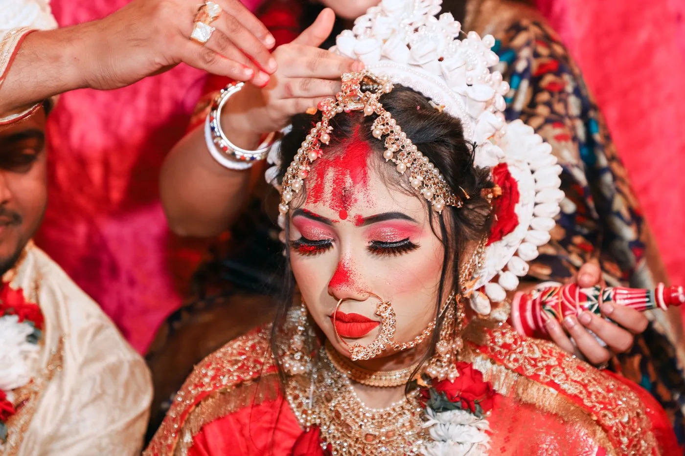 Bride in red with traditional jewellery